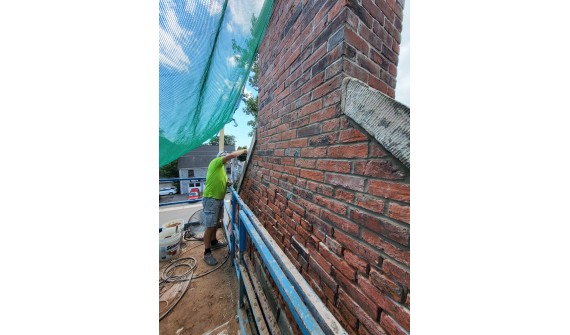 Heritage home in Charlotettown, cut out, ready for repointing, with some repointing done.
